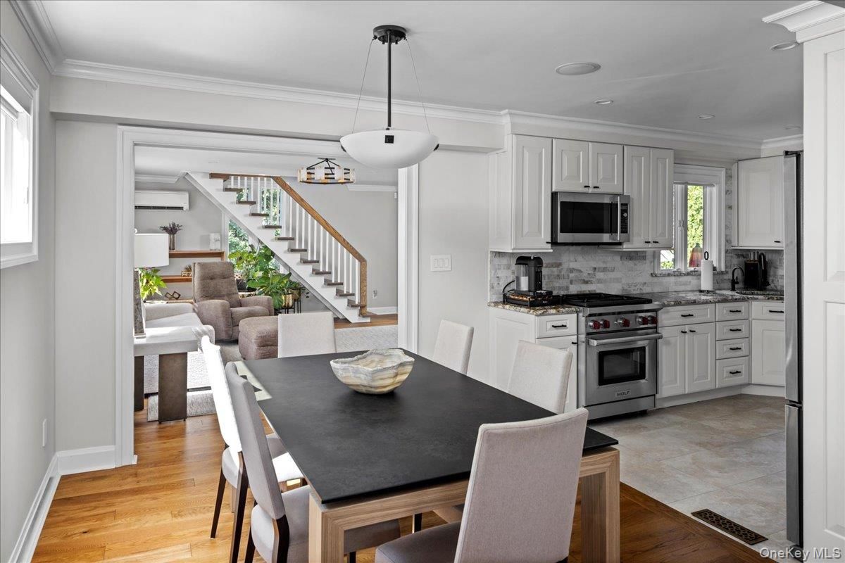 Dining room, Interior, Kitchen, Pendant Lights, Recessed Lighting, Stainless Steel Appliances, Wood Texture Flooring