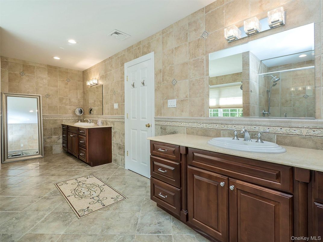 Bathroom, Dual Sink Vanities, Glass Shower, Interior, Recessed Lighting, Stone Walls