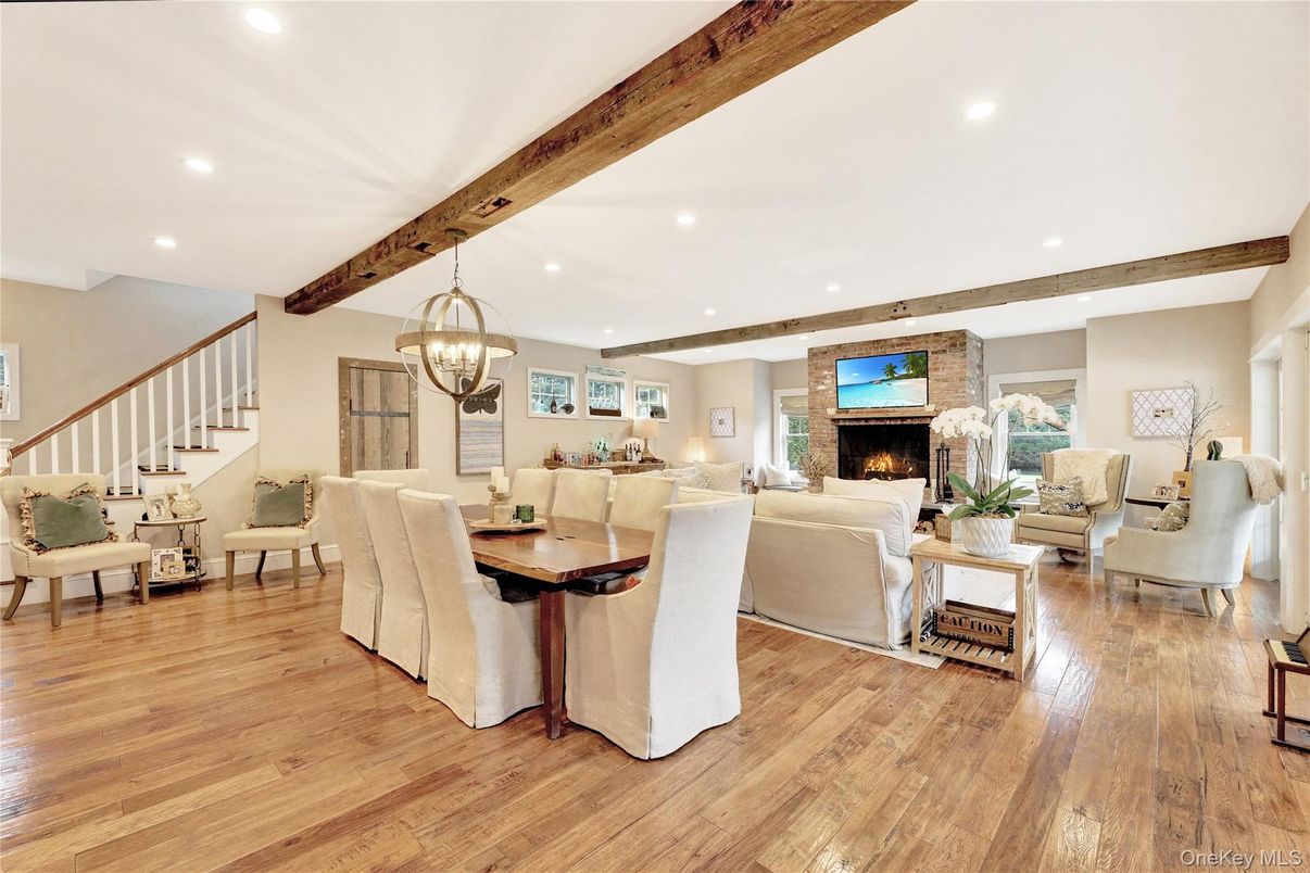 Chandelier, Dining room, Fireplace, Interior, Living room, Recessed Lighting, Wooden Beams, Wood Texture Flooring