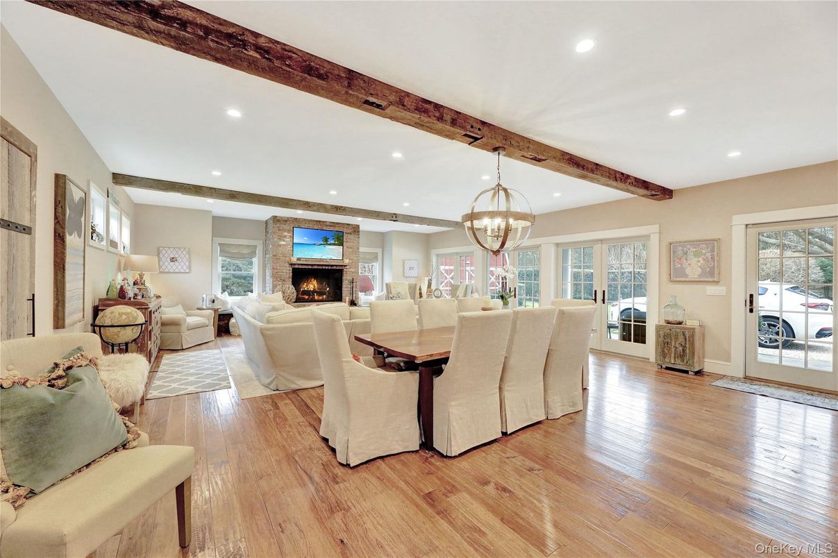 Chandelier, Dining room, Fireplace, Interior, Living room, Recessed Lighting, Wooden Beams, Wood Texture Flooring
