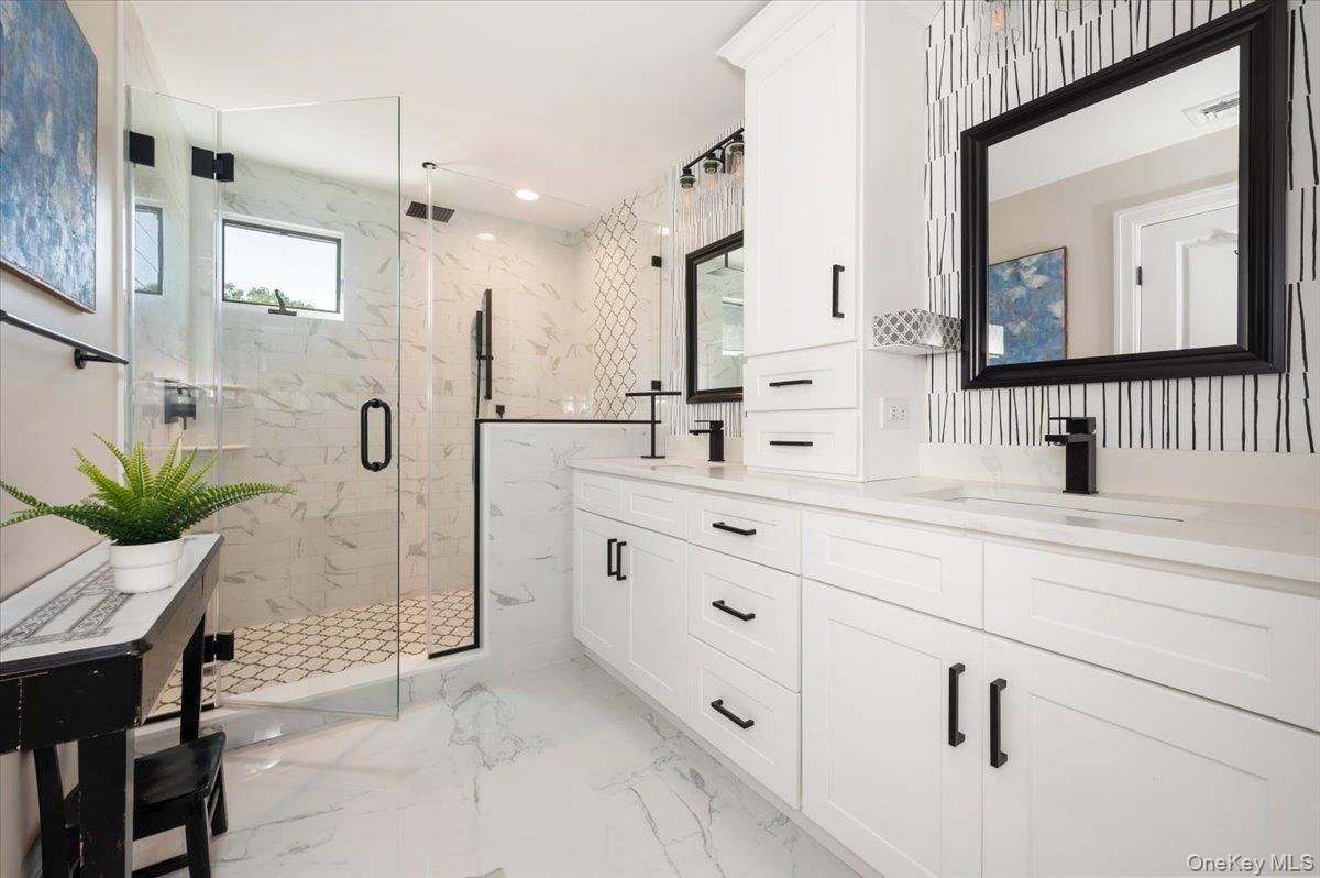 Bathroom, Dual Sink Vanities, Glass Shower, Interior, Marble, Marble Walls, Recessed Lighting