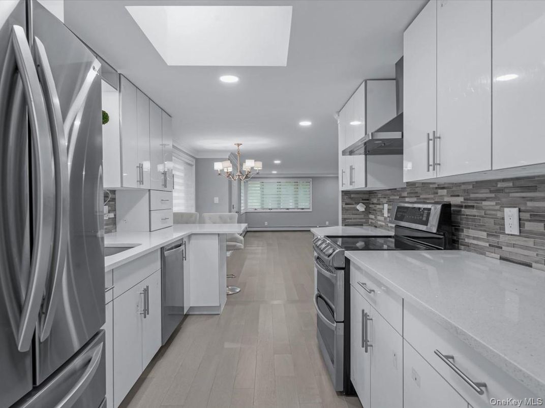 Chandelier, Interior, Kitchen, Recessed Lighting, Stainless Steel Appliances, Wood Texture Flooring