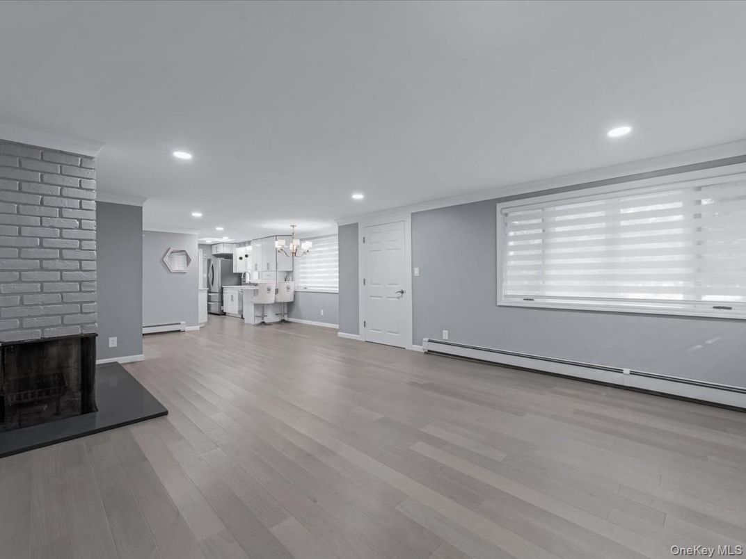 Chandelier, Empty room, Fireplace, Interior, Recessed Lighting, Wood Texture Flooring