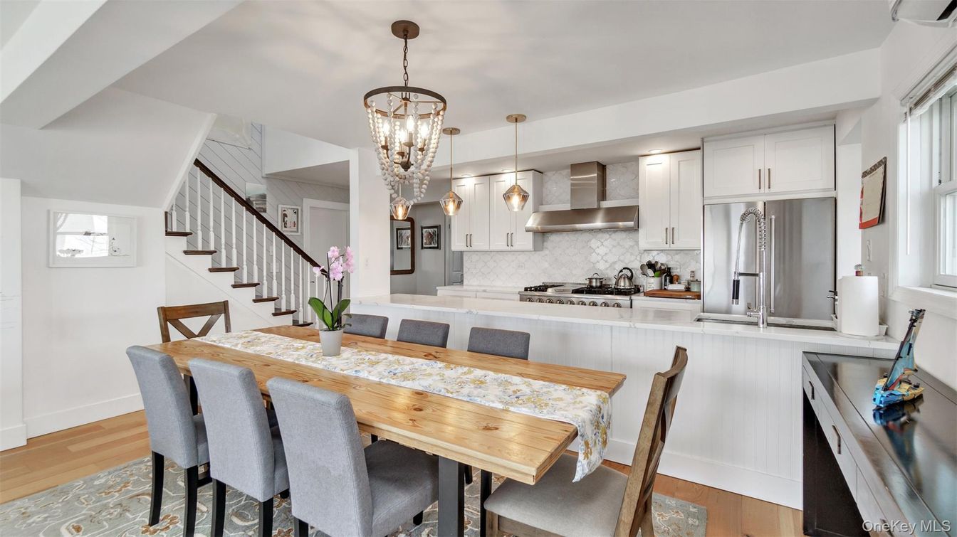 Chandelier, Dining room, Interior, Kitchen, Pendant Lights, Stainless Steel Appliances, Wood Texture Flooring