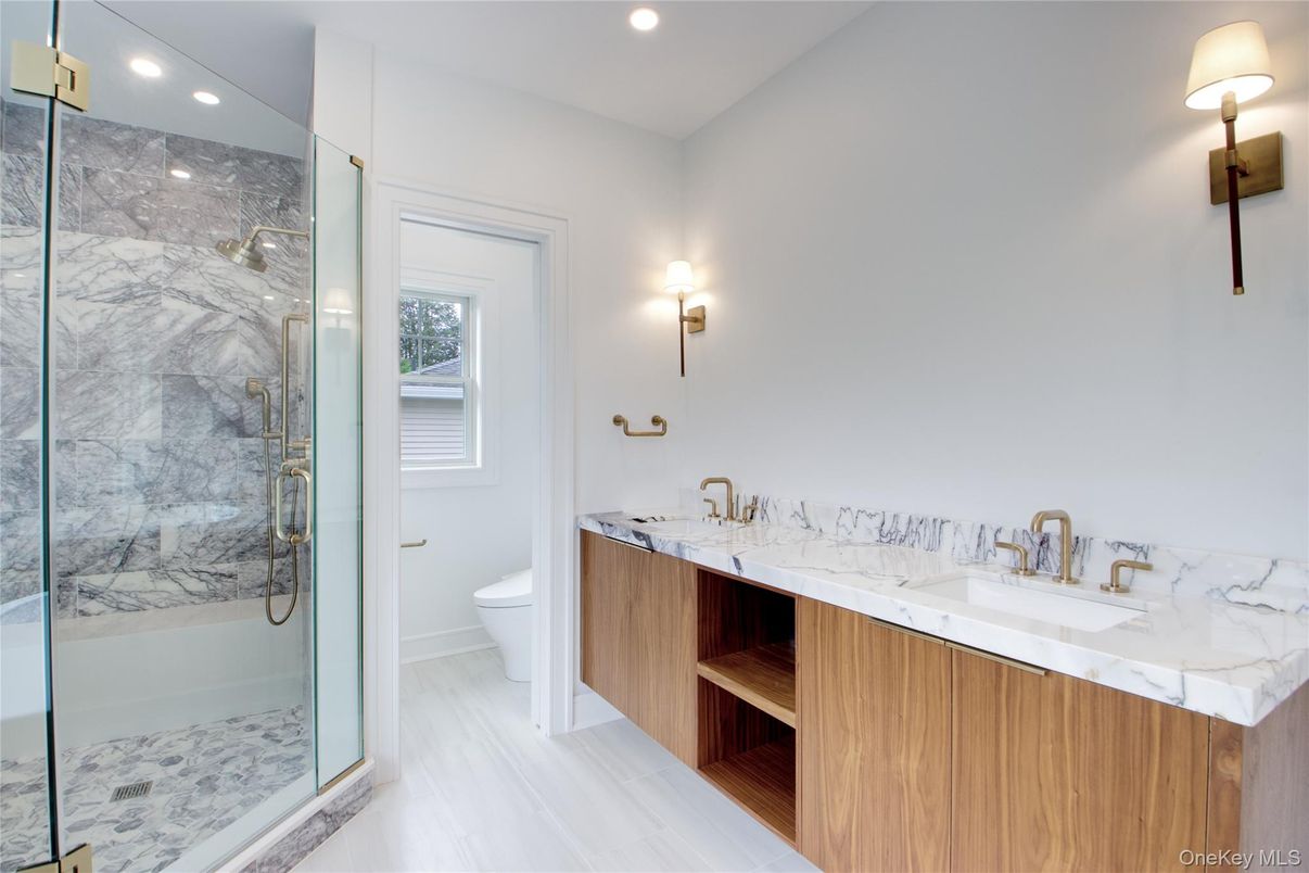 Bathroom, Dual Sink Vanities, Glass Shower, Interior, Marble Walls, Recessed Lighting