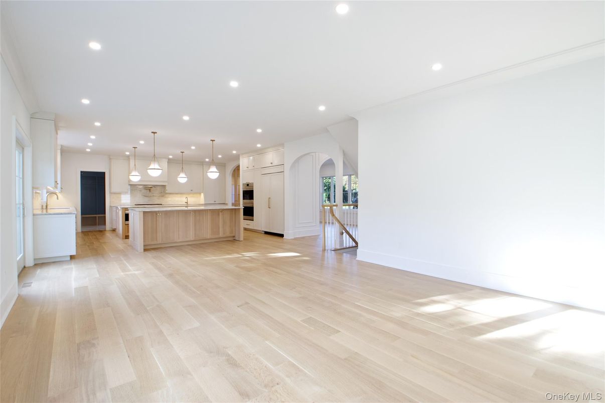 Empty room, Interior, Kitchen, Pendant Lights, Recessed Lighting, Stainless Steel Appliances, Wood Texture Flooring