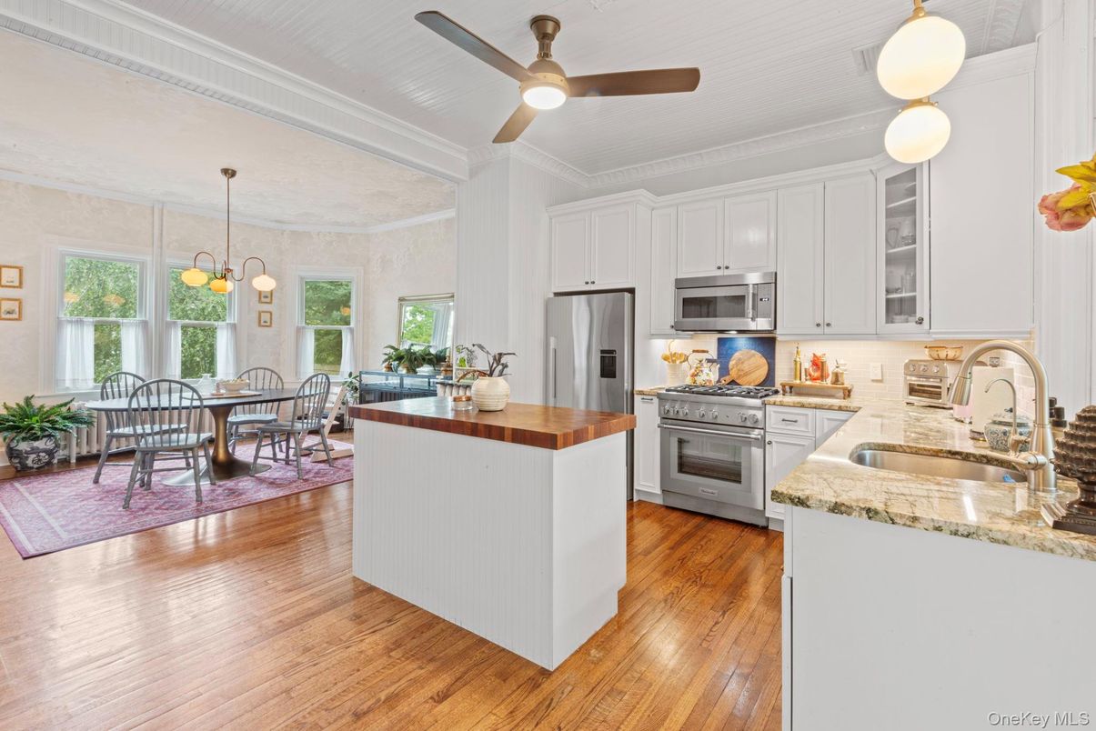 Chandelier, Dining room, Interior, Kitchen, Pendant Lights, Stainless Steel Appliances, Wood Texture Flooring