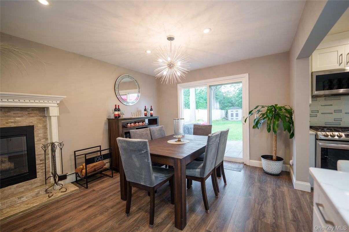 Dining room, Fireplace, Interior, Pendant Lights, Recessed Lighting, Wood Texture Flooring