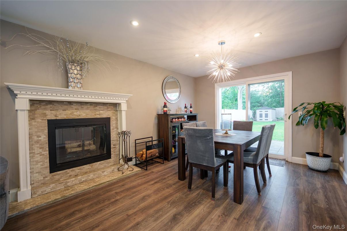 Dining room, Fireplace, Interior, Pendant Lights, Recessed Lighting, Wood Texture Flooring