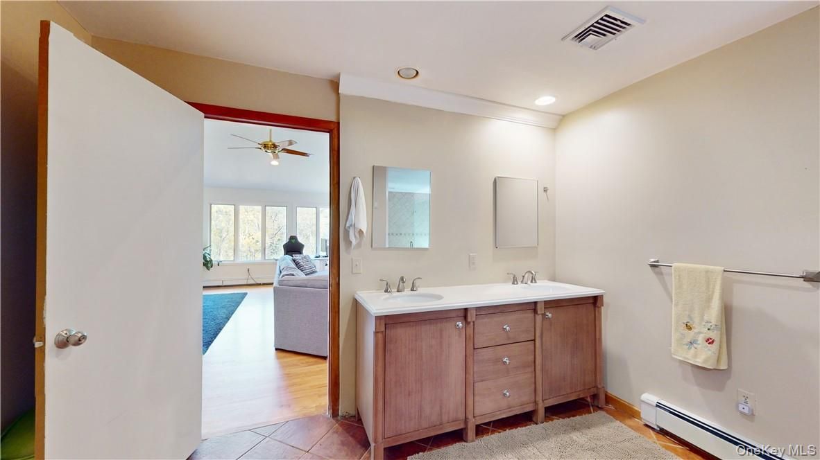 Bathroom, Dual Sink Vanities, Interior, Recessed Lighting, Wood Texture Flooring