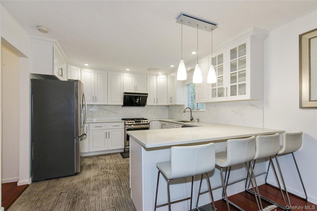 Interior, Kitchen, Marble Walls, Pendant Lights, Recessed Lighting, Stainless Steel Appliances