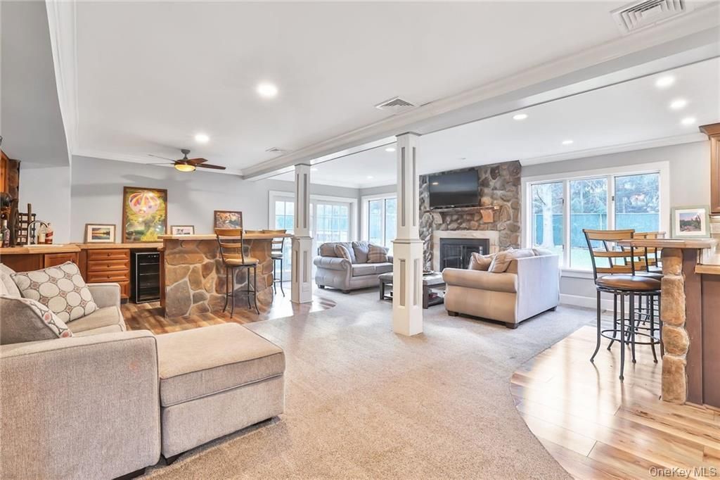 Fireplace, Interior, Living room, Recessed Lighting, Stone Walls, Wood Texture Flooring