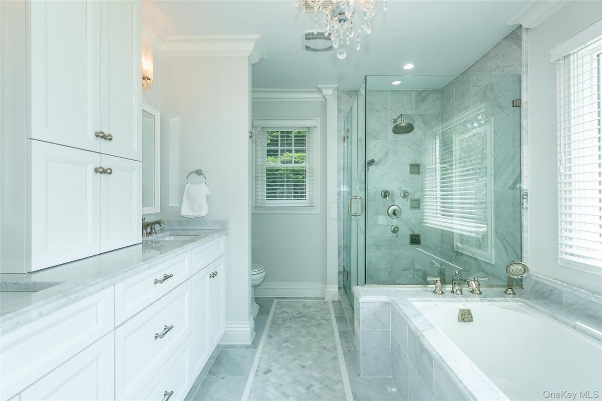 Bathroom, Dual Sink Vanities, Glass Shower, Interior, Marble, Marble Walls, Recessed Lighting