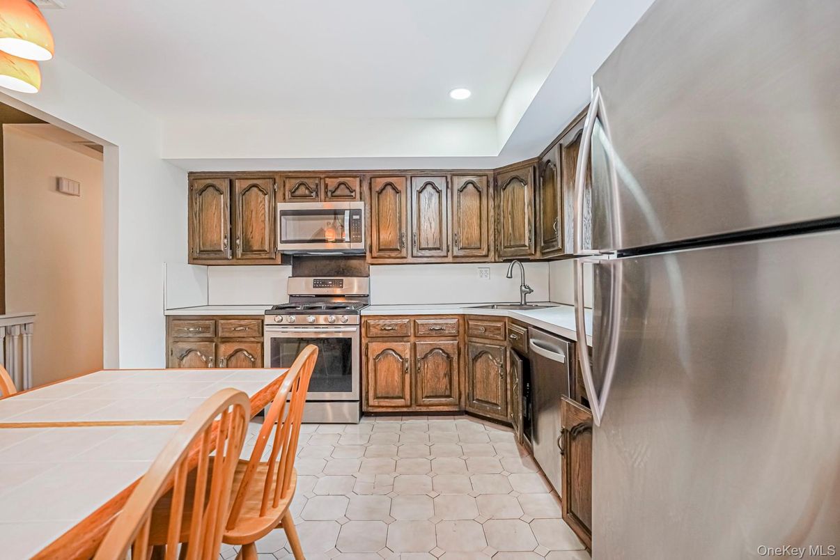 Interior, Kitchen, Recessed Lighting, Stainless Steel Appliances, Tile Countertops