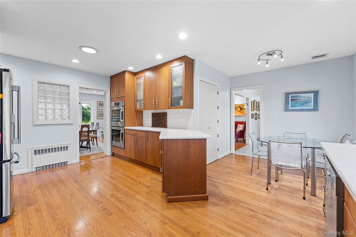 Dining room, Interior, Kitchen, Recessed Lighting, Stainless Steel Appliances, Wood Texture Flooring
