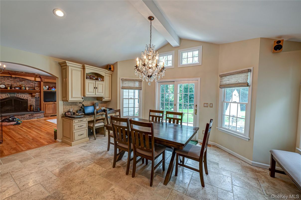Chandelier, Dining room, Fireplace, Interior, Living room, Recessed Lighting, Stone Walls, Wood Texture Flooring