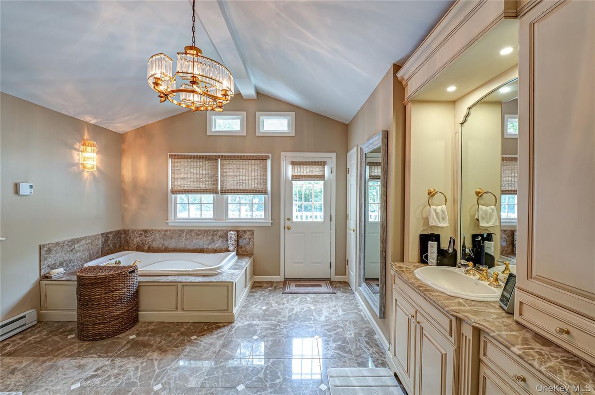 Bathroom, Chandelier, Dual Sink Vanities, Interior, Marble, Pendant Lights, Recessed Lighting