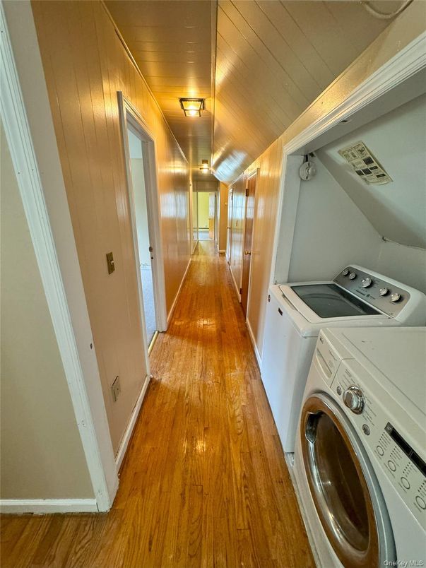 Interior, Utility Closets, Washer, Wood Texture Flooring, Wooden Walls