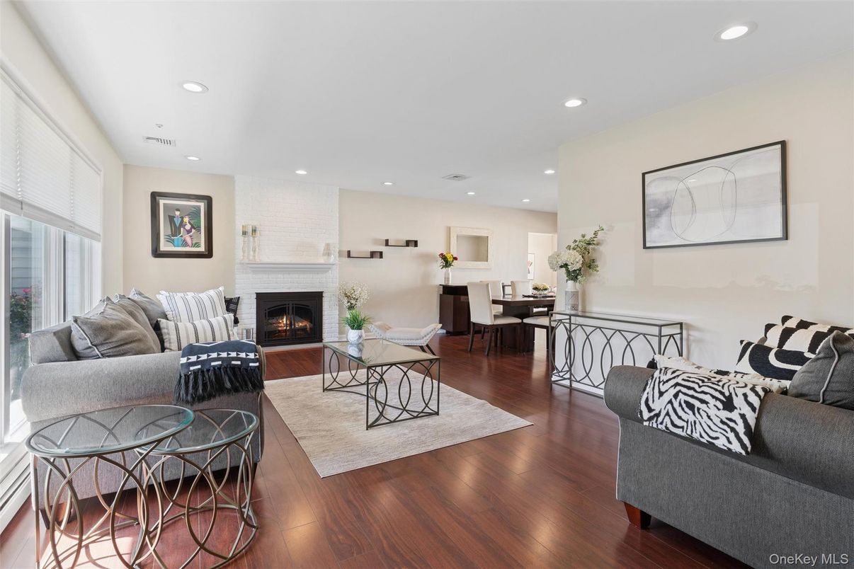 Dining room, Fireplace, Interior, Living room, Recessed Lighting, Wood Texture Flooring
