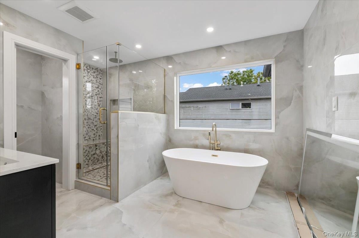 Bathroom, Free Standing Baths, Glass Shower, Interior, Marble, Marble Walls, Recessed Lighting
