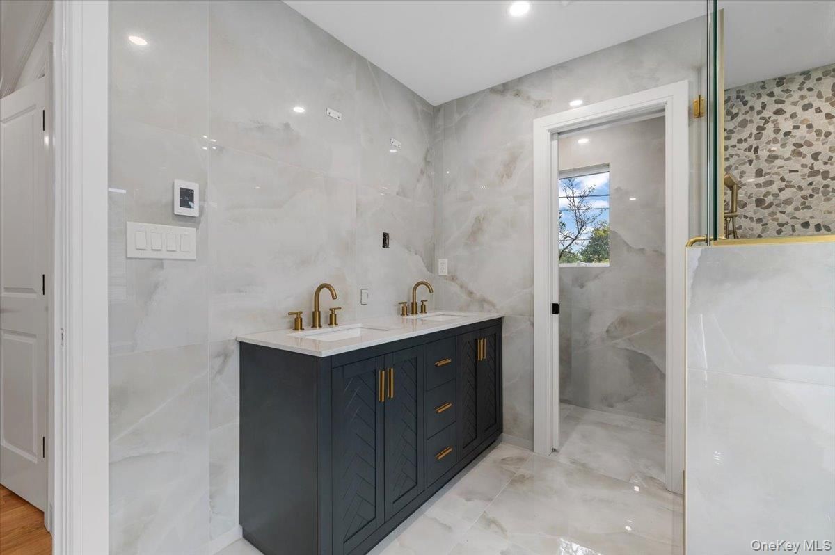 Bathroom, Dual Sink Vanities, Glass Shower, Interior, Marble Walls, Recessed Lighting