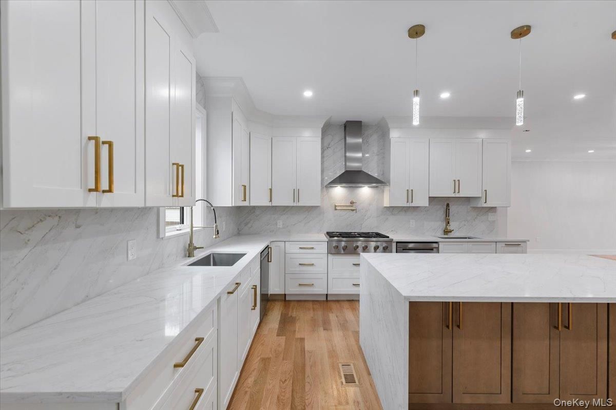 Interior, Kitchen, Marble Walls, Pendant Lights, Recessed Lighting, Stainless Steel Appliances, Wood Texture Flooring