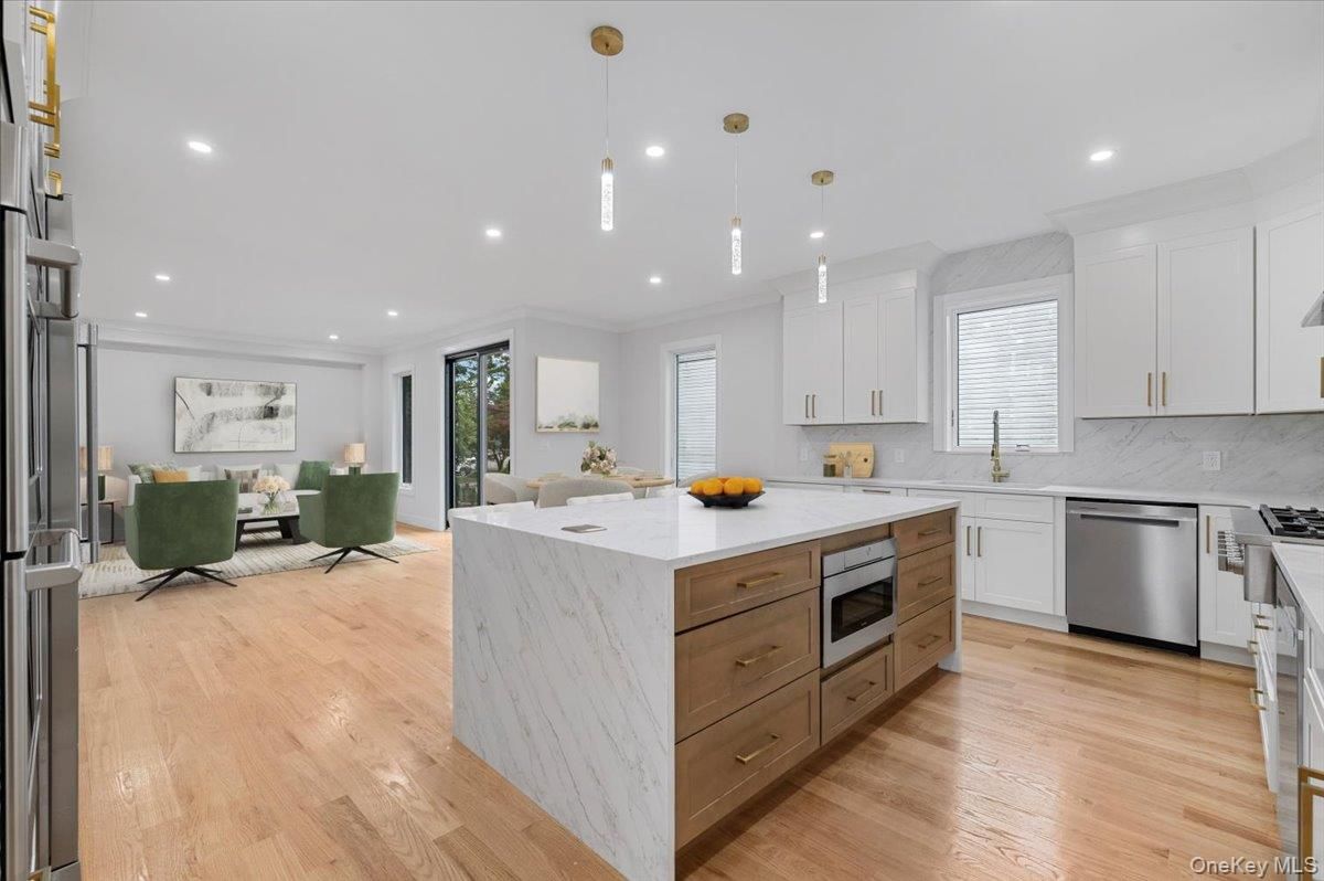 Dining room, Interior, Kitchen, Living room, Pendant Lights, Recessed Lighting, Stainless Steel Appliances, Wood Texture Flooring