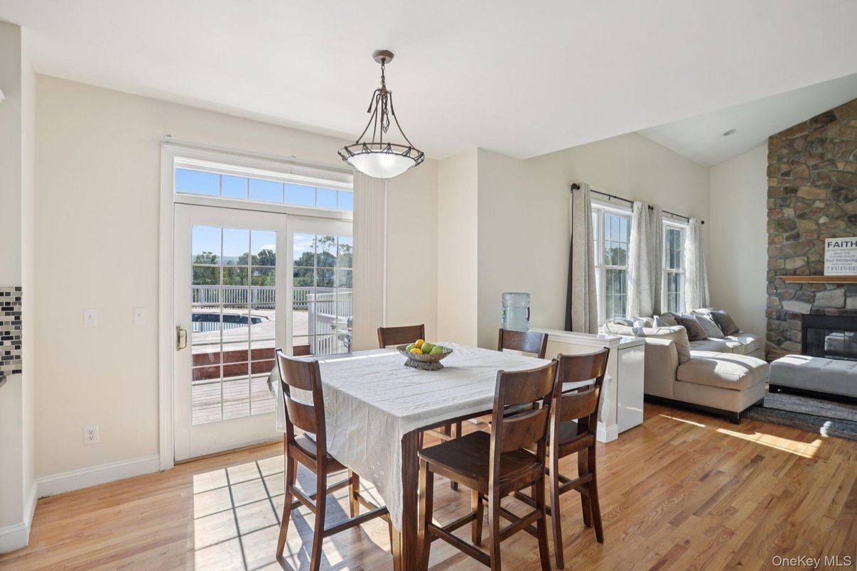 Dining room, Fireplace, Interior, Living room, Pendant Lights, Stone Walls, Wood Texture Flooring