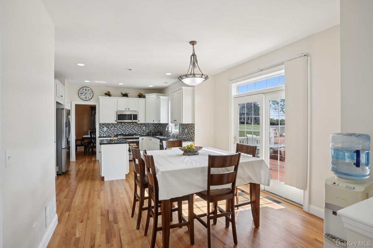 Dining room, Interior, Kitchen, Pendant Lights, Recessed Lighting, Stainless Steel Appliances, Wood Texture Flooring