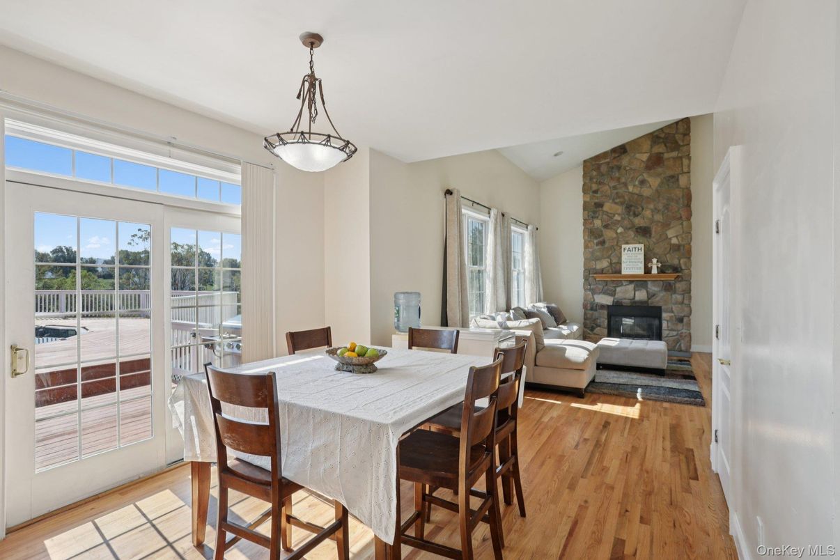 Dining room, Fireplace, Interior, Living room, Pendant Lights, Stone Walls, Wood Texture Flooring