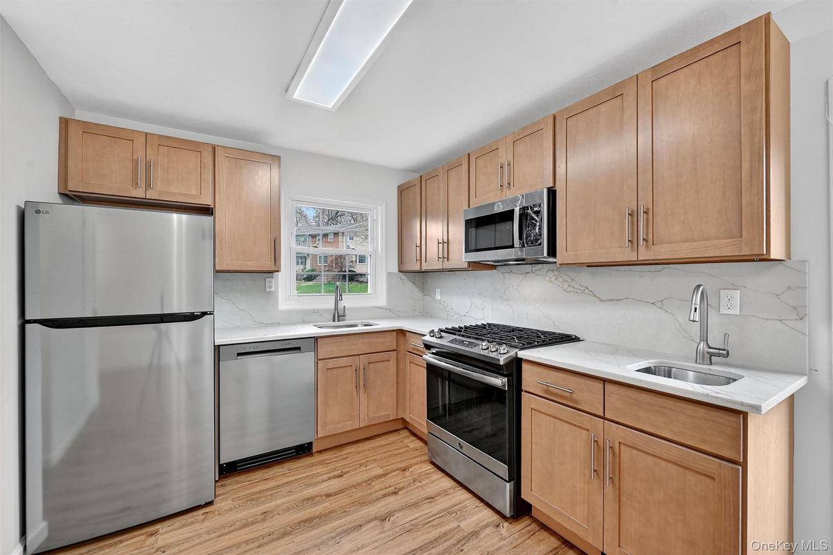 Interior, Kitchen, Marble Walls, Stainless Steel Appliances, Wood Texture Flooring