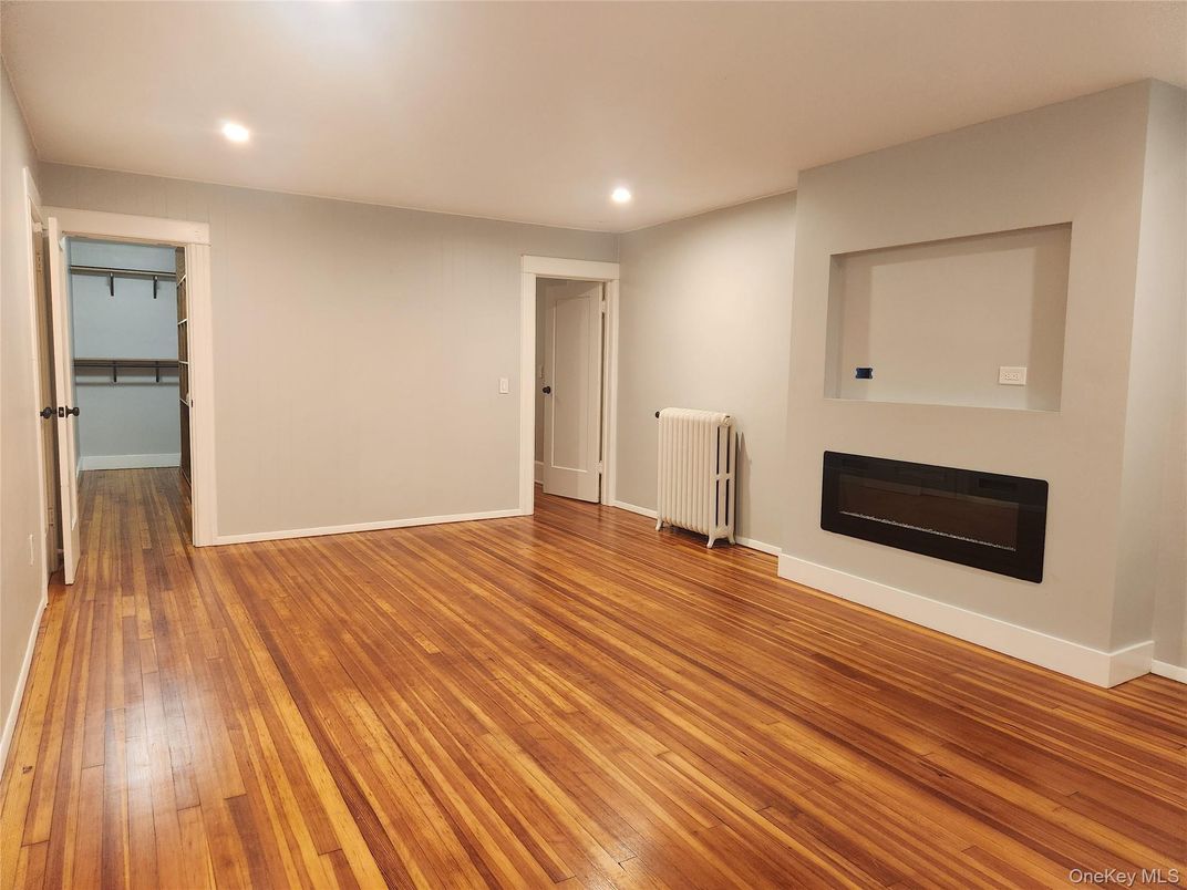 Empty room, Fireplace, Interior, Recessed Lighting, Wood Texture Flooring