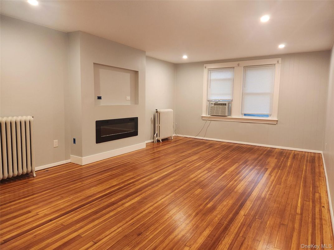 Empty room, Fireplace, Interior, Recessed Lighting, Wood Texture Flooring