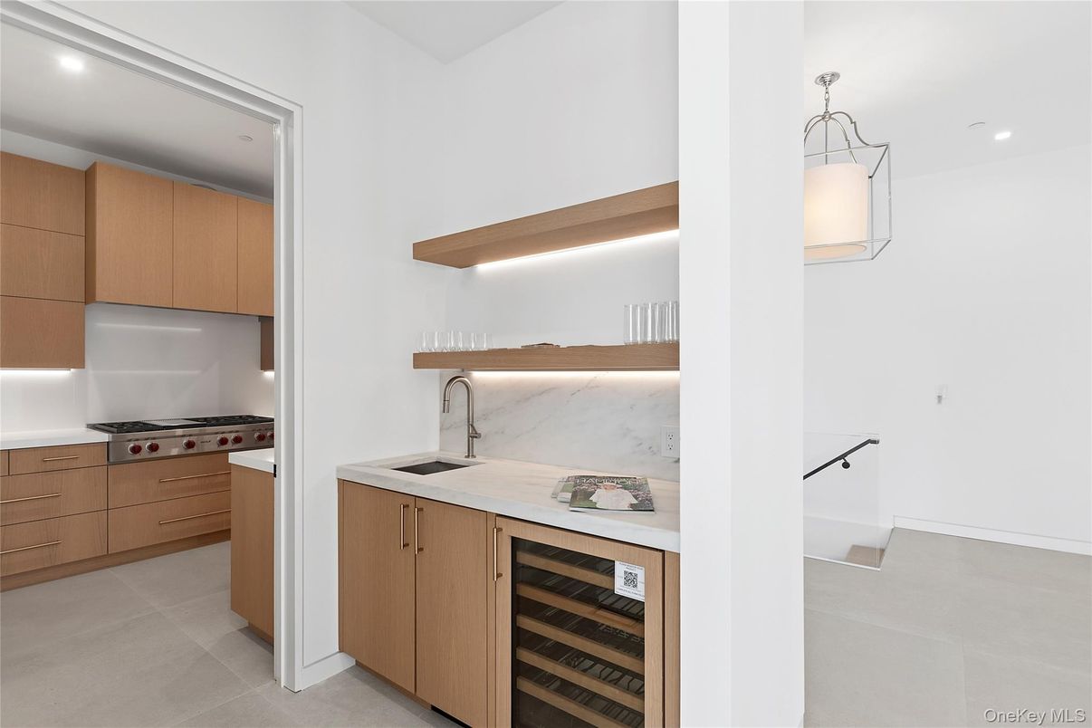 Interior, Kitchen, Marble Walls, Pendant Lights, Recessed Lighting, Stainless Steel Appliances