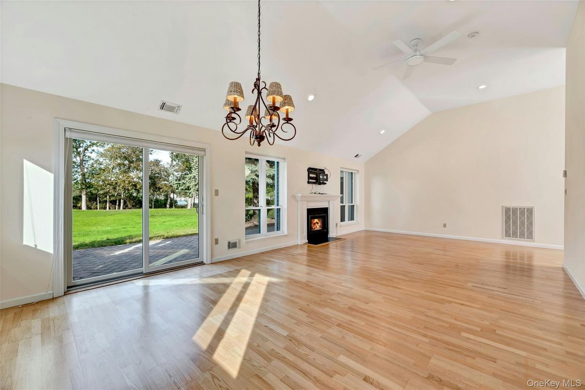 Chandelier, Empty room, Fireplace, Interior, Recessed Lighting, Wood Texture Flooring