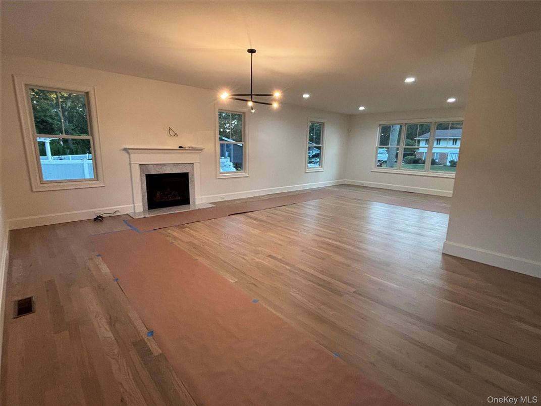 Empty room, Fireplace, Interior, Pendant Lights, Recessed Lighting, Wood Texture Flooring