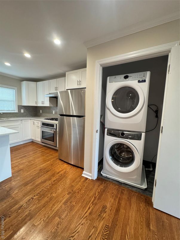 Interior, Kitchen, Recessed Lighting, Stainless Steel Appliances, Utility Closets, Washer, Wood Texture Flooring
