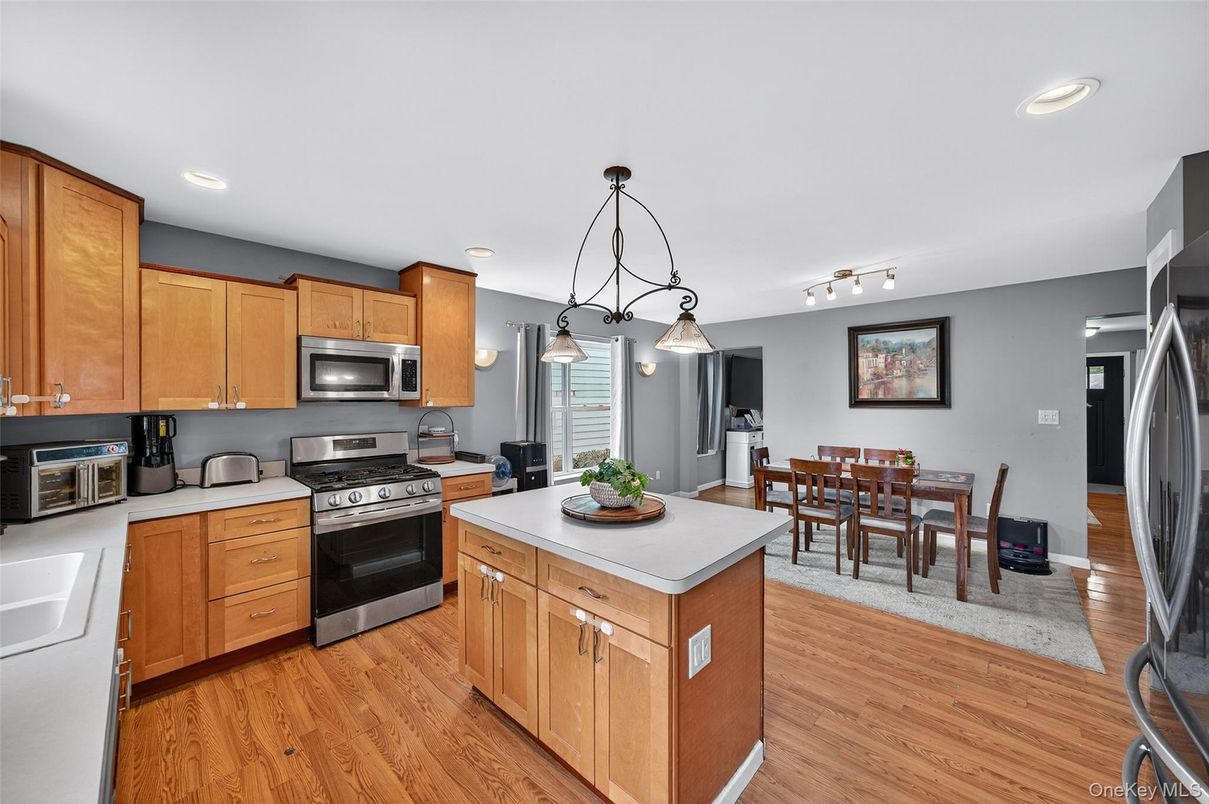 Dining room, Interior, Kitchen, Pendant Lights, Recessed Lighting, Stainless Steel Appliances, Wood Texture Flooring