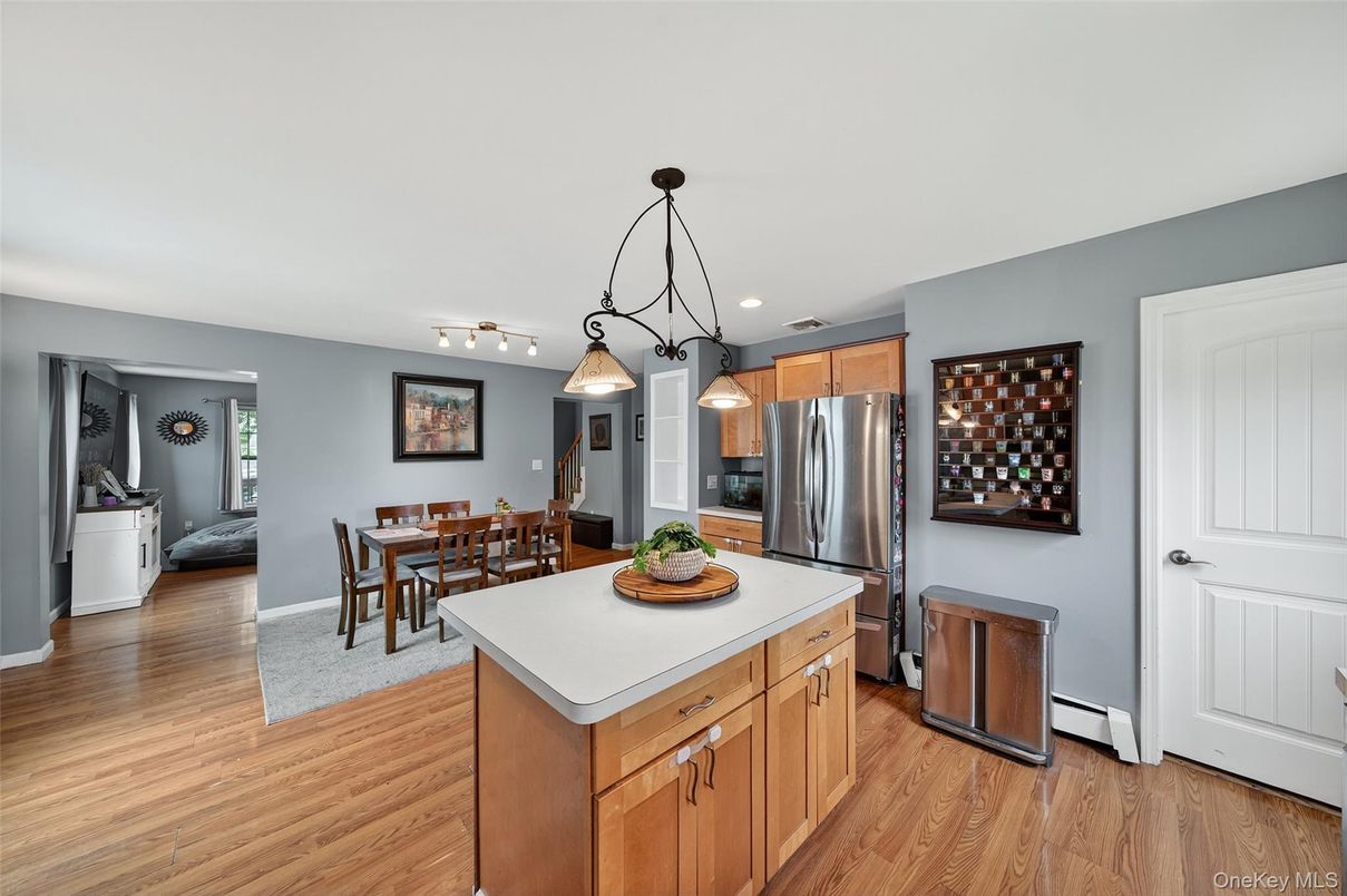 Dining room, Interior, Kitchen, Pendant Lights, Recessed Lighting, Stainless Steel Appliances, Wood Texture Flooring