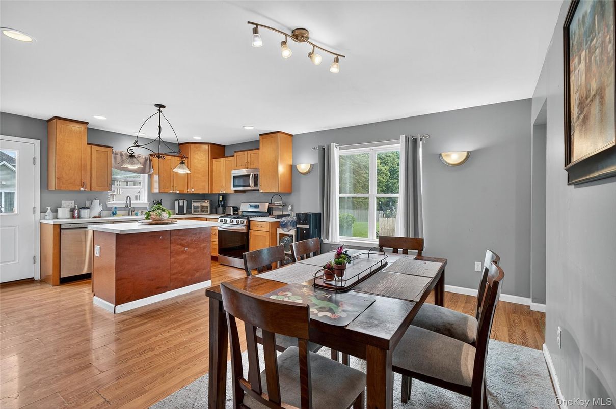 Dining room, Interior, Kitchen, Pendant Lights, Recessed Lighting, Stainless Steel Appliances, Wood Texture Flooring
