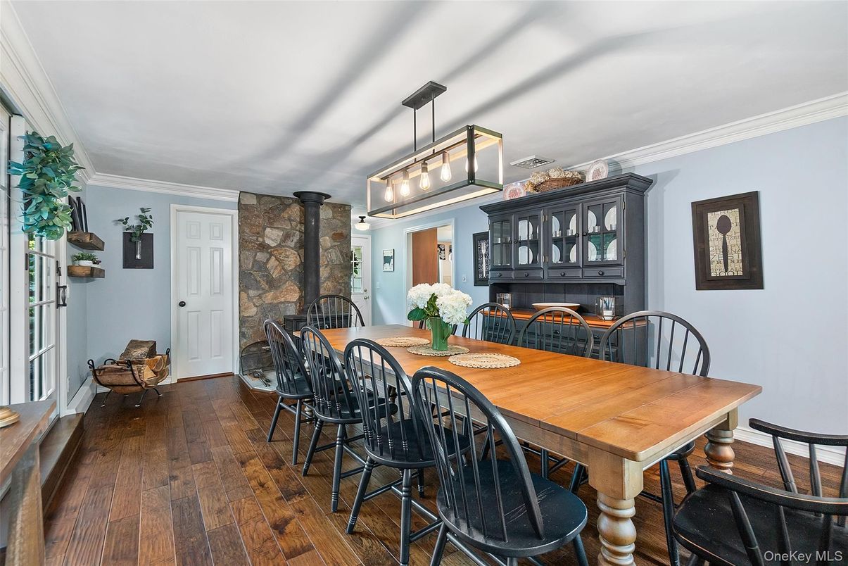 Dining room, Fireplace, Interior, Pendant Lights, Stone Walls, Wood Texture Flooring