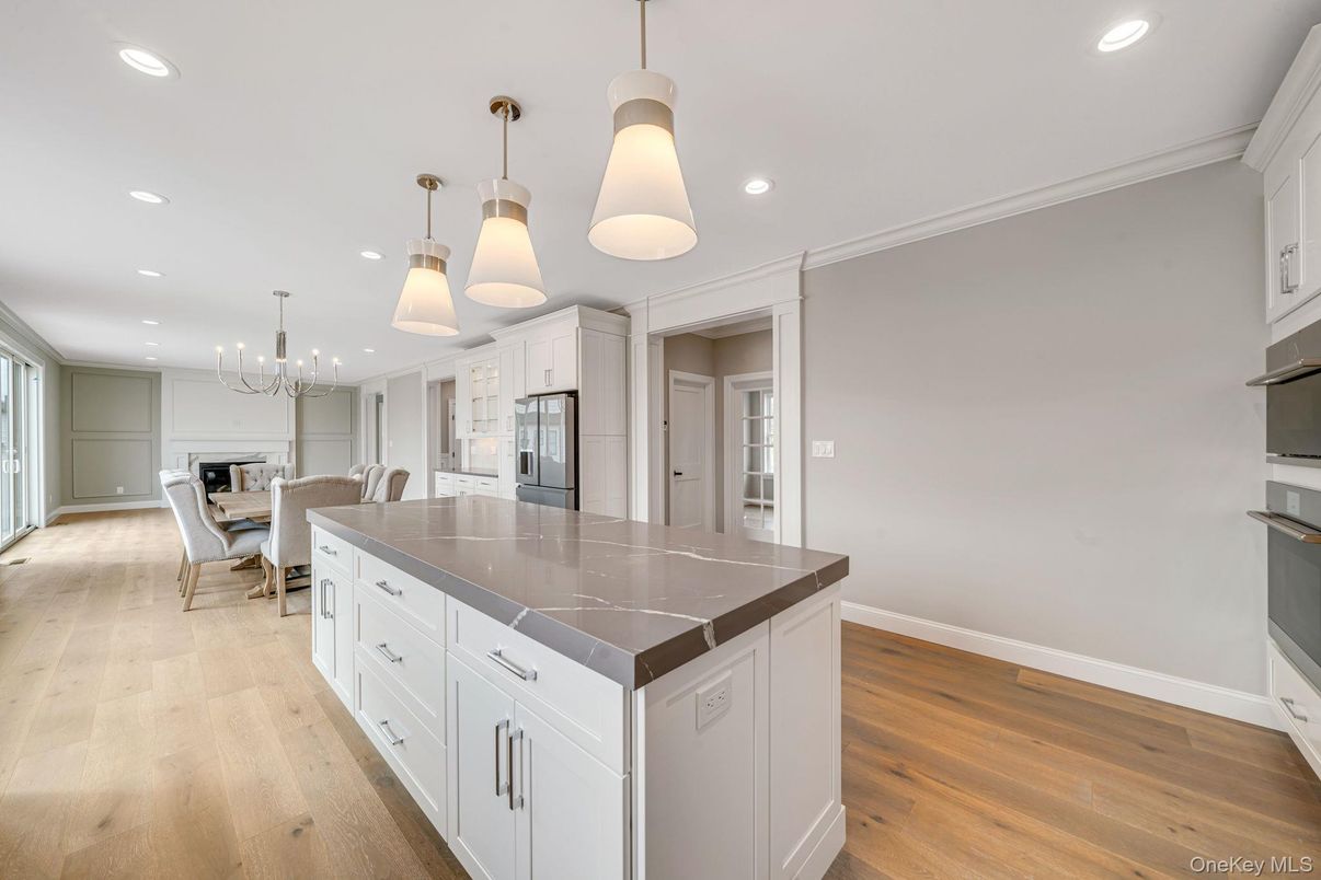 Dining room, Interior, Kitchen, Pendant Lights, Recessed Lighting, Stainless Steel Appliances, Wood Texture Flooring