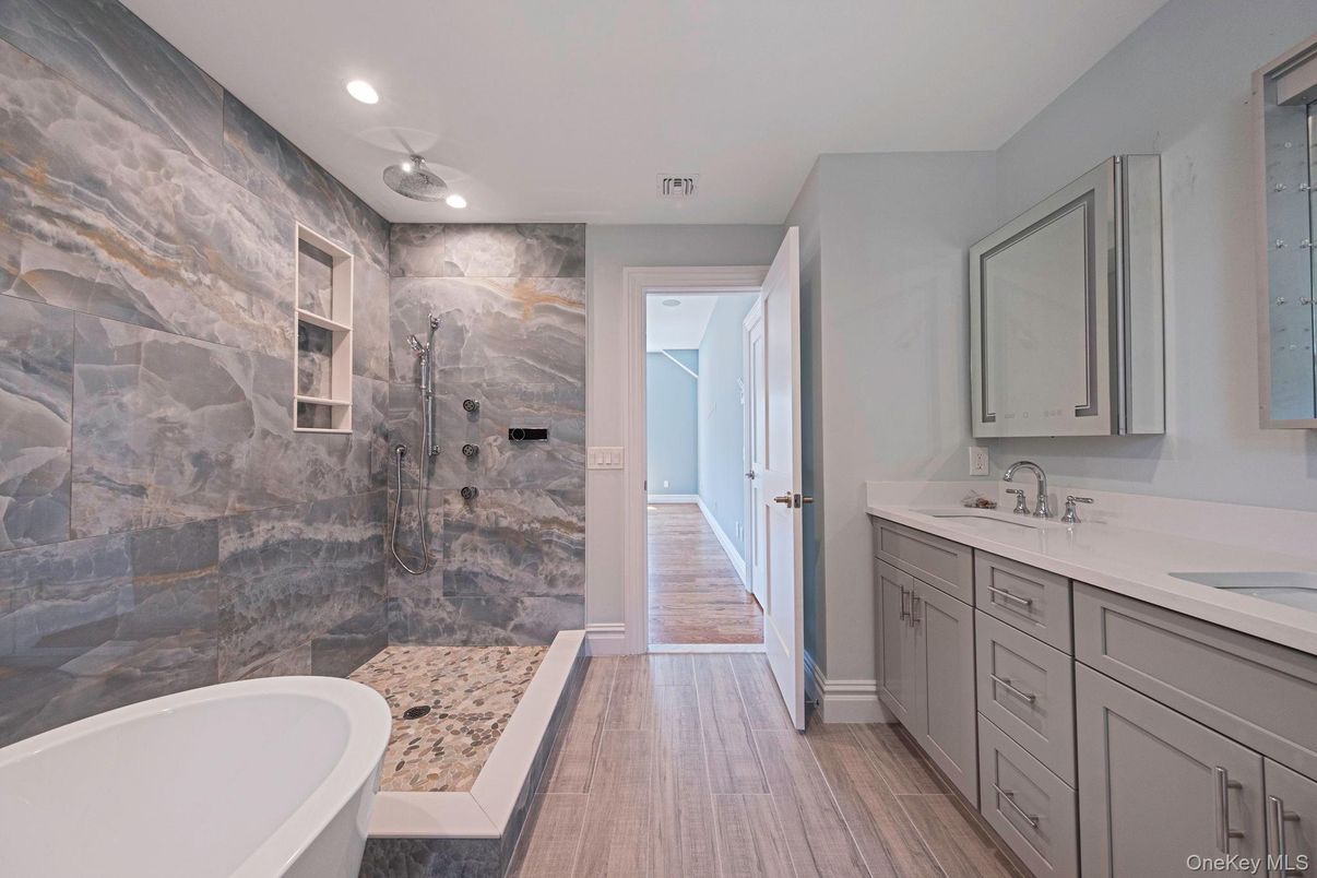 Bathroom, Dual Sink Vanities, Glass Shower, Interior, Recessed Lighting, Wood Texture Flooring
