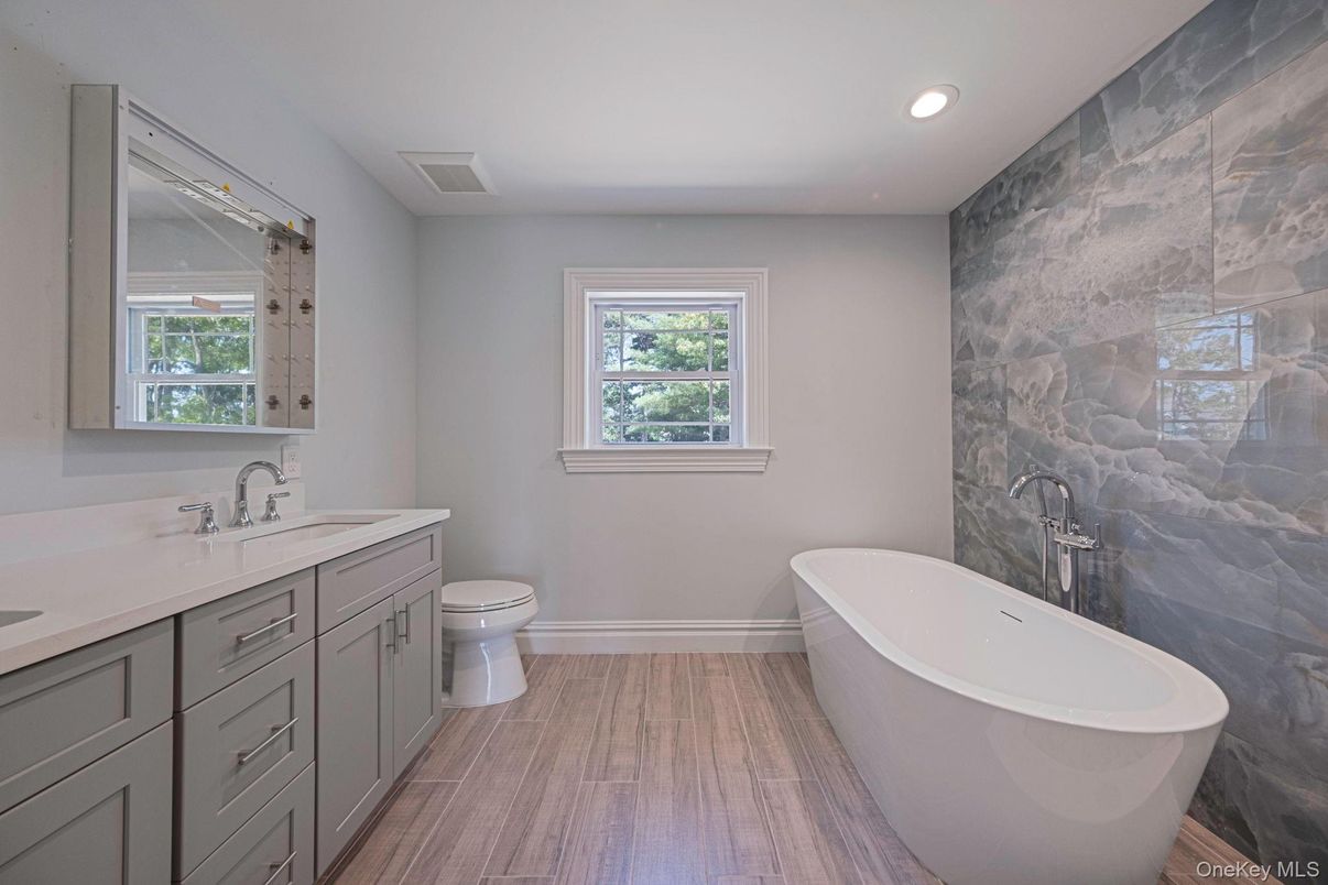 Bathroom, Dual Sink Vanities, Free Standing Baths, Interior, Recessed Lighting, Wood Texture Flooring