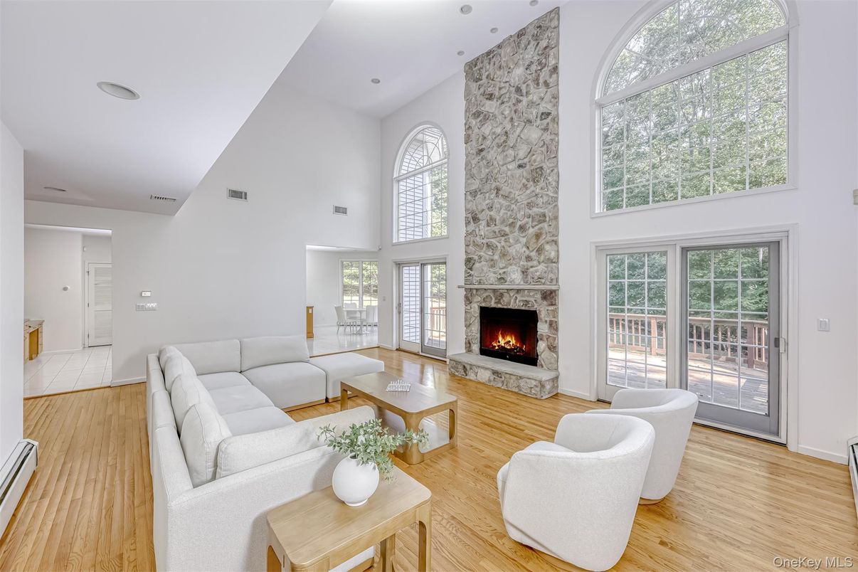 Fireplace, Interior, Living room, Recessed Lighting, Stone Walls, Wood Texture Flooring