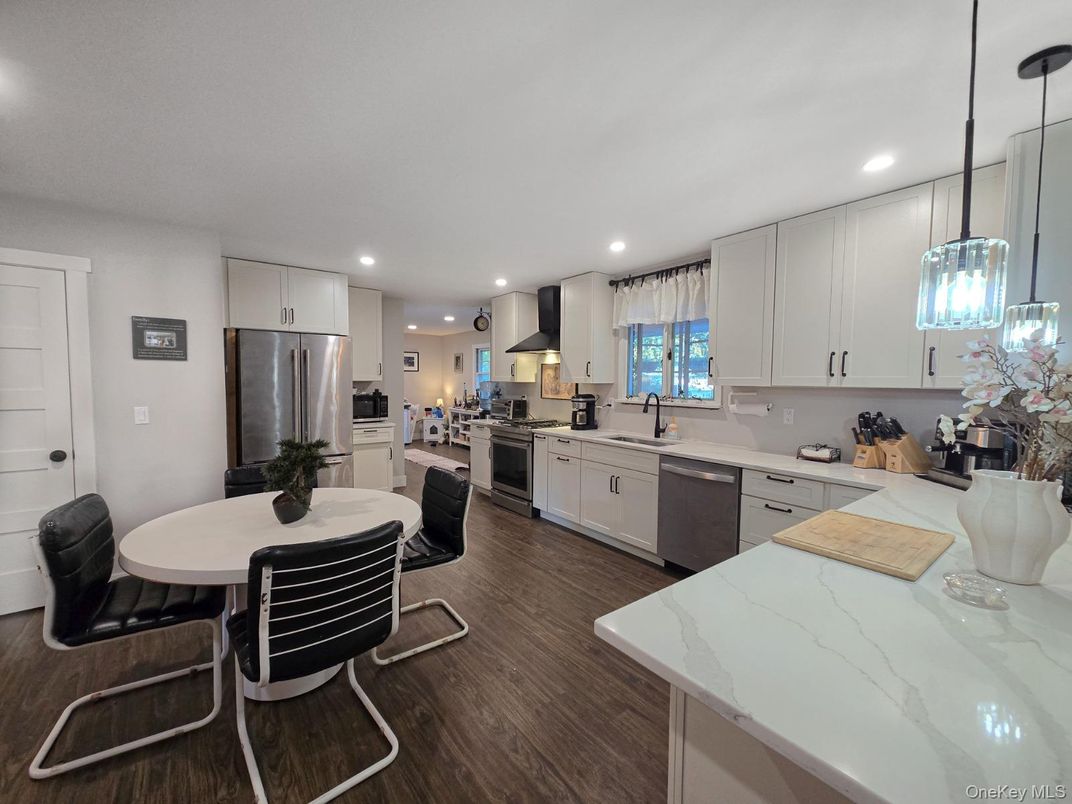 Dining room, Interior, Kitchen, Pendant Lights, Recessed Lighting, Stainless Steel Appliances, Wood Texture Flooring