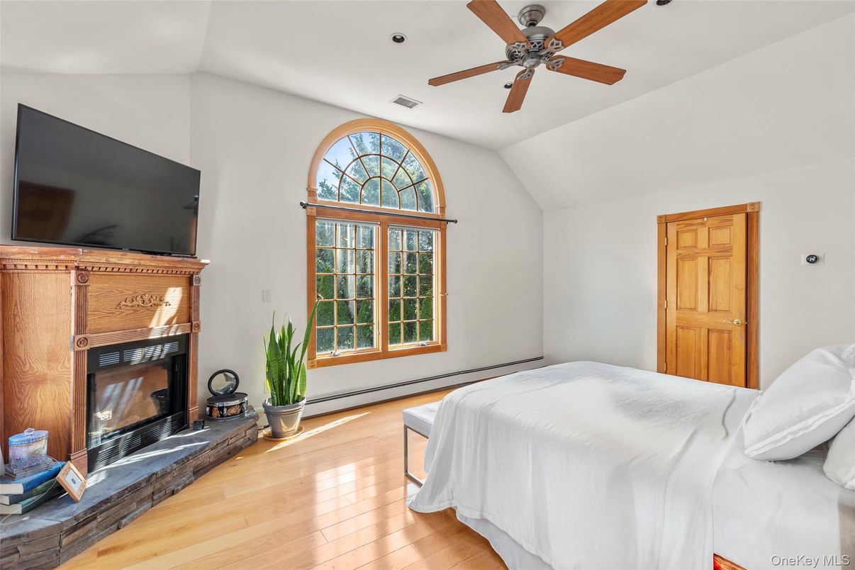 Bedroom, Fireplace, Interior, Recessed Lighting, Wood Texture Flooring