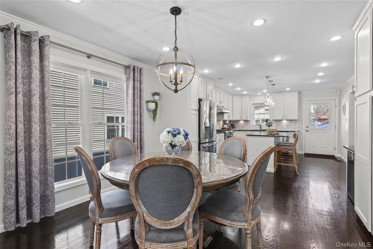 Chandelier, Dining room, Interior, Kitchen, Pendant Lights, Recessed Lighting, Stainless Steel Appliances, Wood Texture Flooring
