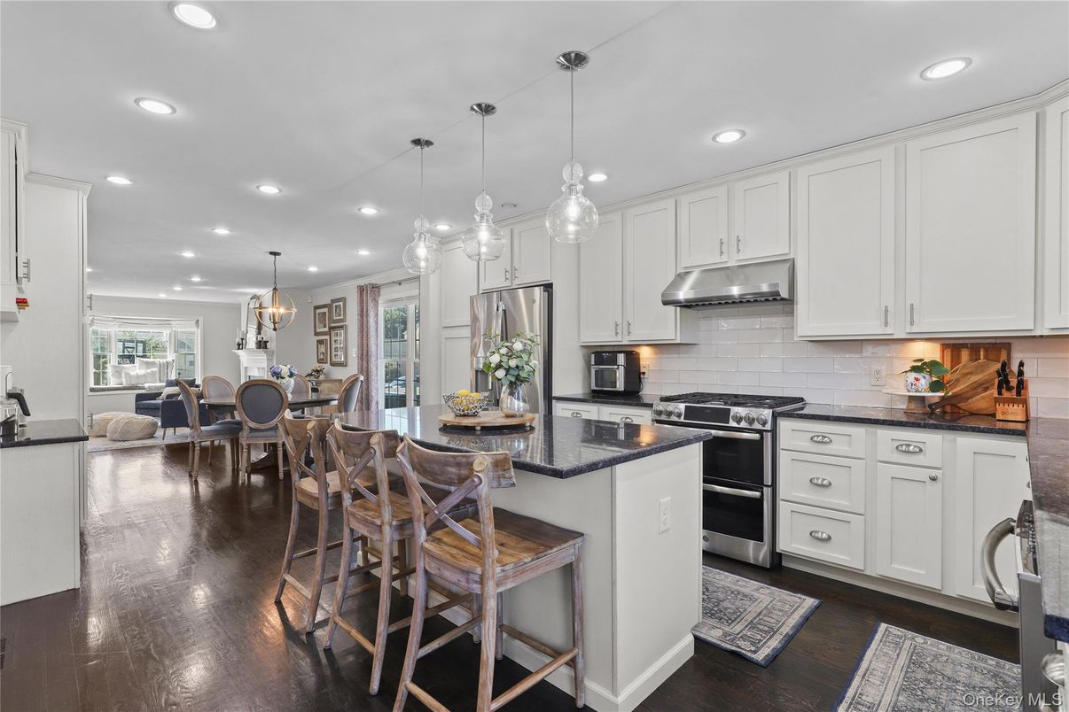 Chandelier, Dining room, Interior, Kitchen, Pendant Lights, Recessed Lighting, Stainless Steel Appliances, Wood Texture Flooring