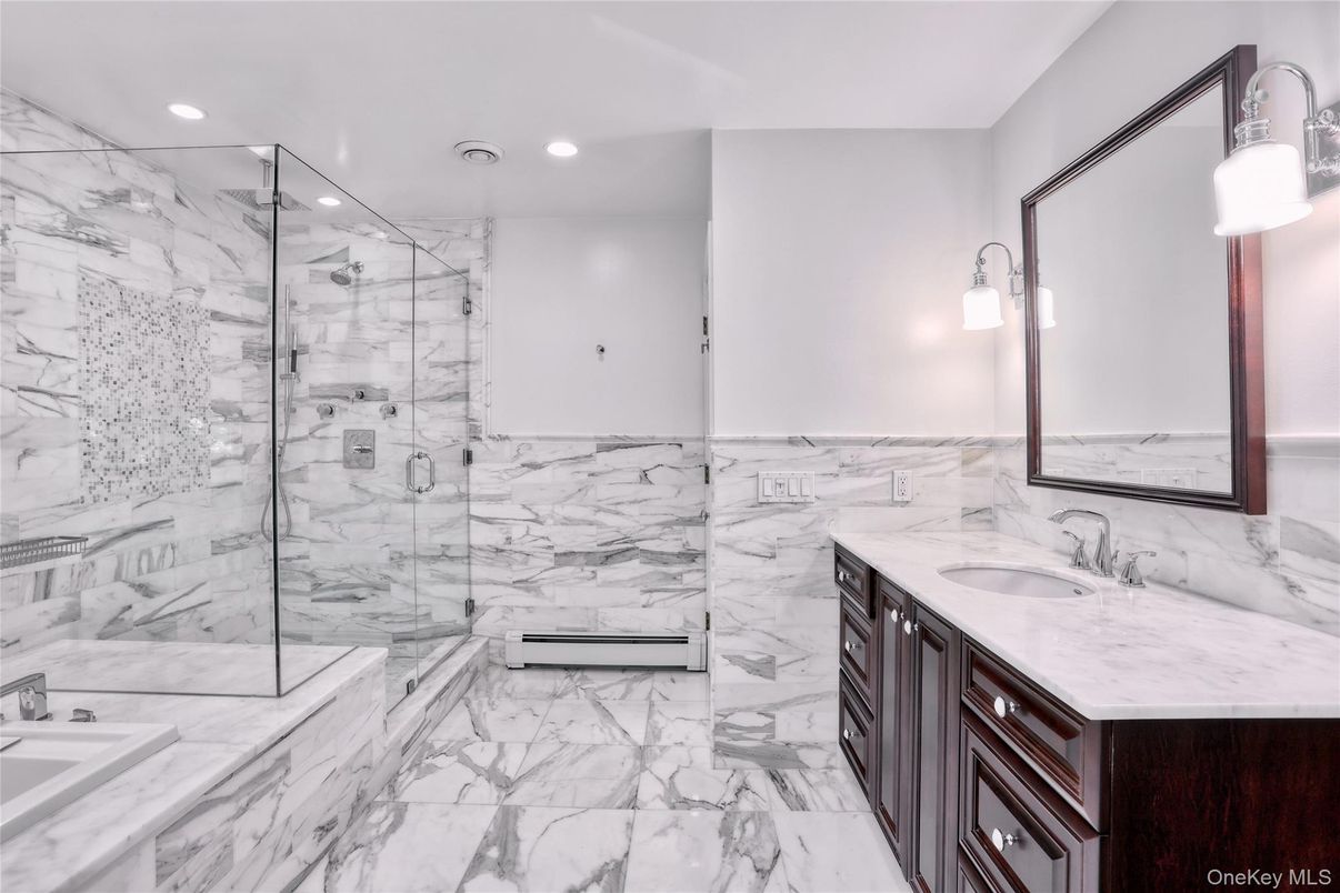 Bathroom, Dual Sink Vanities, Glass Shower, Interior, Marble, Marble Walls, Recessed Lighting